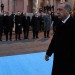 Turkey's Prime Minister Tayyip Erdogan walks past his ministers (rear L-R) European Affairs Minister Egemen Bagis, Economy Minister Zafer Caglayan, Energy Minister Taner Yildiz, Agriculture Minister Mehdi Eker, Interior Minister Muammer Guler and Education Minister Nabi Avci during a ceremony in Ankara December 18, 2013.