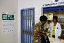 A woman receives medication at Phedisong clinic's pharmacy on April 8, 2024 during the launch of the new single dose anti-AIDs drug in Ga-Rankuwa,100 kms north of Johannesburg. 