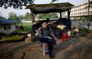 A police officer mans a roadside checkpoint in Yangon, Myanmar, Tuesday, March 26, 2013.