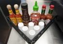 Salt shakers and other condiments sit on a beverage dispenser table at a Boston Market restaurant in Alexandria, VA on May 14, 2013.