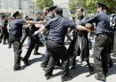 Policemen try to stop an Orthodox Christian activist during clashes with gay rights activists at an International Day Against Homophobia and Transphobia (IDAHO) rally in Tbilisi, May 17, 2013. 