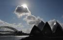 Clouds drift over the Opera House (below-R) and the Harbour Bridge (below-L) in Sydney on May 28, 2024 ahead of rain predicted for the area on May 29 and well into the following week.