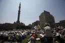 Members of the Muslim Brotherhood and supporters of ousted Egyptian President Mohamed Mursi attend Friday prayers at Ramses Square in Cairo August 16, 2013. 
