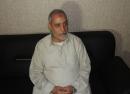 Muslim Brotherhood leader Mohamed Badie sits at a police station after being arrested by security forces in Cairo, in this Egyptian Interior Ministry handout picture provided on August 20, 2013.