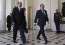French President Francois Hollande (R) and Ahmad Jarba (L), head of the opposition Syrian National Coalition, walk in the lobby of the Elysee Palace before a meeting in Paris August 29, 2013. The opposition Syrian National Coalition urged Western powers to launch a punitive strike against Bashar al-Assad's government quickly and offer real military and political support to stop people being 