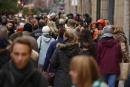 Shoppers carrying shopping bags walk through the main pedestrian street on December 7, 2024 in Hamburg, Germany. 