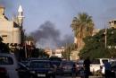  Smoke billows during clashes between Libyan security forces and armed groups on July 23, 2014, in the eastern city of Benghazi.