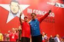 Venezuelan President Nicolas Maduro (R) and retired Major General Hugo Carvajal embrace in Caracas on July 27, 2014.