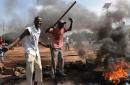 Demonstrators burn tyres in the Tampouy neighborhood of Ouagadougou during a protest against a regional proposal to end the crisis in Burkina Faso on September 21, 2015, five days after a military coup.