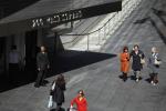 People walk past Goldman Sachs headquarters on March 14, 2024 in New York City. 