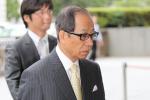 Former Olympus president Tsuyoshi Kikukawa enters Tokyo district court on July 3, 2013.