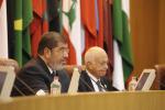 Egypt's President Mohamed Mursi (L) talks at the Arab League headquarters in Cairo September 5, 2012. 