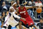 Miami Heat forward LeBron James (6) is defended by Atlanta Hawks' Josh Smith in the first half of a preseason NBA basketball game, Sunday, Oct. 7, 2012, in Atlanta.