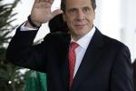 New York Gov. Andrew Cuomo waves to members of the media upon his arrival to the West Wing of the White House in Washington, Monday, Dec. 3, 2012, for a scheduled meeting with White House officials. 
