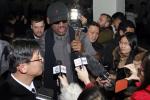 Flamboyant former NBA star Dennis Rodman is surrounded by journalists upon arrival at Pyongyang Airport, North Korea, Tuesday, Feb. 26, 2013. The American known as "The Worm" arrived in Pyongyang, becoming an unlikely ambassador for sports diplomacy at a time of heightened tensions between the U.S. and North Korea. 