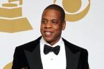 In this Feb. 10, 2013 file photo, Jay-Z poses backstage with the awards for best rap/sung collaboration for "No Church in the Wild" and best rap performance for "N****s in Paris" at the 55th annual Grammy Awards, in Los Angeles.