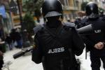 Spanish riot police officers stand guard during a demonstration in Oviedo April 2, 2013.