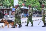 Kenyan police officers keep vigil outside the Supreme Court in Nairobi on March 30, 2013.