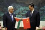 China's President Xi Jinping, right, and his Palestinian counterpart Mahmoud Abbas attend a signing ceremony at the Great Hall of the People in Beijing, China Monday, May 6, 2013. (AP Photo/Jason Lee, Pool)