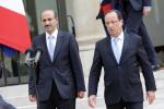 France's president Francois Hollande, right, accompanies Syria National Coallition president Ahmed al-Jarba after their meeting at the Elysee Palace in Paris, France, Wednesday, July 24, 2013.