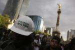 A demonstrator wears a helmet with a sticker that reads "Pemex is not for sale" during a protest against the privatization of the state oil monopoly Pemex in Mexico City in this July 1, 2024 file photo. 