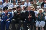 Russian President Vladimir Putin, second right, with World War II veterans and prominent motor biker Alexander Zaldostanov, second left, attends an opening ceremony of newly built fountain called Children Dancing in the southern Russian city of Volgograd, once known as Stalingrad, Friday, Aug. 23, 2013. The fountain is a replica of a fountain which miraculously survived in heavy bombing in Stalingrad in 1942. The original fountain survived until 1951. This year Russia celebrated the 70th anniversary of the 