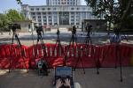A journalists monitors a blog providing details of the trial of former politician Bo Xilai outside the Jinan Intermediate People's Court in Jinan in eastern China's Shandong province on Monday, Aug. 26, 2013. Former Chinese politician Bo Xilai's trial on charges of bribery, embezzlement and abuse of power goes into its fifth day. (AP Photo/Ng Han Guan)