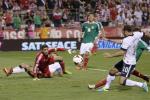 United States' Landon Donovan, right, scores a goal as Mexico goalkeeper Jose de Jesus Corona watches during the second half of a World Cup qualifying soccer match Tuesday, Sept. 10, 2013, in Columbus, Ohio. 