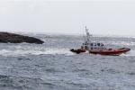A Coast Guard boat leaves the harbor of the island of Lampedusa, southern Italy, Friday, Oct. 4, 2013. A ship carrying African migrants towards Italy capsized off the Sicilian island of Lampedusa Thursday, spilling hundreds of passengers into the sea, officials said. Authorities resumed Friday their search for bodies in the migrant shipwreck, in which officials say just 155 people survived of the 450 to 500 believed to have been on board. (AP Photo/Luca Bruno)