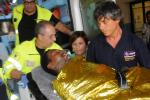 A man is carried off an ambulance at the Palermo Civico hospital, Italy, Thursday, Oct. 3, 2013 after being rescued off the Italian island of Lampedusa.