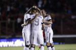 Aron Johannsson, center, of the U.S. celebrates with teammates after scoring a goal against Panama in a 2014 World Cup qualifying soccer match, in Panama City, Tuesday, Oct. 15, 2013. The United States rallied for a 3-2 win at Panama on Tuesday night that left Mexico's World Cup hopes alive and knocked out the Panamanians. 
