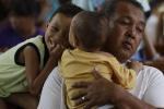 Typhoon survivors take shelter inside a Catholic church in Tacloban city, Leyte province in central Philippines Friday Nov. 22, 2013. 