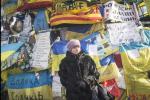 KIEV, UKRAINE - JANUARY 26: A woman listens to speeches during an anti-government rally in Independence Square on January 26, 2024 in Kiev, Ukraine. Violent protests in Ukraine continue with opposition leaders rejecting President Viktor Yanukovych's offer to appoint them to top government posts.