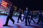 Armed police patrol the scene of the terror attack at the Kunming train station in Yunnan province on March 2, 2014.