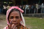 An Indian voter shows her inked finger after voting outside a polling station in Dibrugarh on April 7, 2014.