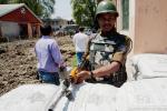 An Indian paramilitary soldier stands guard at a distribution center ahead of the next round of voting on April 29, 2024 in Srinagar, the summer capital of Indian administered Kashmir, India. 