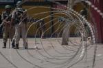 Indian paramilitary soldier guard the deserted roads in the main city during a curfew following a killing of a youth on May 01, 2024 in Srinagar, the summer capital of Indian-administered Kashmir, India. 