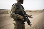 NAHAL-OZ, ISRAEL - MAY 19: A Bedouin soldier looks for markings at the border of Israel and the Gaza Strip May 19, 2024 in Nahal-Oz, Israel. The IDF's tracking unit, mostly made up of Bedouin soldiers from 25 different tribes, was created in order to patrol for infiltrators and possible terror activity along Gaza/Israel border. Credit Ilia Yefimovich/Getty Images