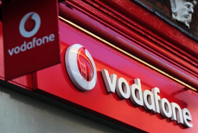 A sign for a Vodafone store is pictured in central London on May 22, 2012. British mobile phone operator Vodafone wrote down the value of its businesses in Spain and Italy Tuesday by £5.9 billion ($9.4 billion) and lowered its cash-flow forecast, as recession-hit southern Europeans cut back on using their mobile phones.