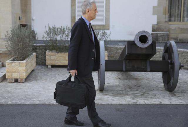 Cypriot Finance Minister Michael Sarris leaves the presidential palace following a meeting with President Nicos Anastasiades on March 18, 2024 in Nicosia. 
