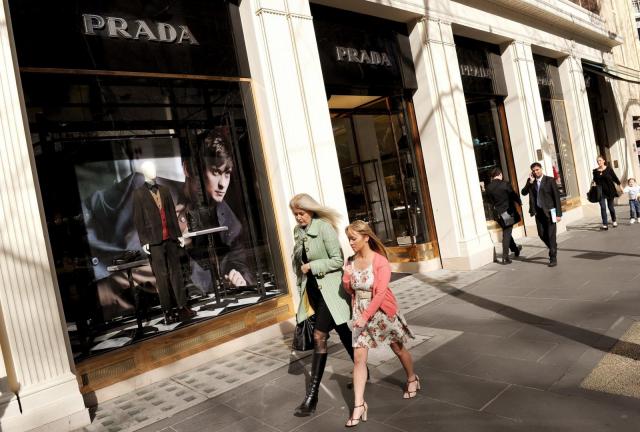 People walk past a Prada store in the Melbourne CBD, on August 3, 2011. Australia's economy expanded in the second quarter by a slightly better than expected 2.6% year-on-year thanks to a boost in consumer spending. People walk past a Prada store in the Melbourne CBD, on August 3, 2011.