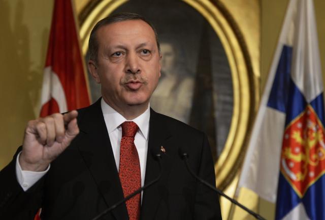 Turkish Prime Minister Recep Tayyip Erdogan addresses journalists during a press conference at the Government Banquet Hall in Helsinki on November 6, 2013. 