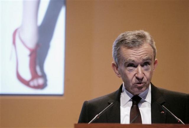 In this Feb. 5, 2009 file photo, Bernard Arnault. Chairman and CEO of LVMH Moet Hennessy Louis Vuitton, the Paris-based luxury goods empire, presents the group's 2008 results in Paris. La Libre Belgique newspaper reported Saturday Sept.8, 2012 that Arnault's citizenship application was confirmed by the head of Belgium's naturalization office. French media drew a connection to French President Francois Hollande's plan to raise the tax rate on France's highest earners to 75 percent.