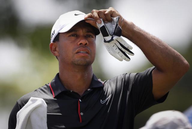 Tiger Woods of the United States watches the field on the 10th hole during round two of CIMB Classic golf tournament at the Mines Resort and Golf Club in Kuala Lumpur, Malaysia, Friday, Oct. 26, 2012. Tiger Woods of the United States watches the field on the 10th hole during round two of CIMB Classic golf tournament at the Mines Resort and Golf Club in Kuala Lumpur, Malaysia, Friday, Oct. 26, 2012.