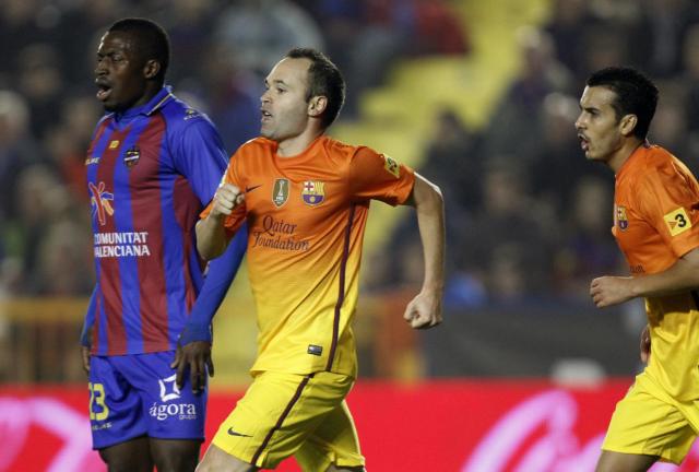 Barcelona's Andres Iniesta celebrates after scoring a goal against Levante during their la liga soccer match at the Ciutat Valencia stadium in Valencia, Spain, Sunday, Nov. 25, 2012. Barcelona's Andres Iniesta celebrates after scoring a goal against Levante during their la liga soccer match at the Ciutat Valencia stadium in Valencia, Spain, Sunday, Nov. 25, 2012.