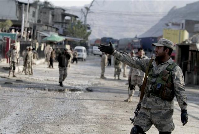 Afghan border police stand guard near border of Afghanistan and Pakistan.
