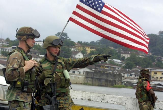 US soldiers (L) guard on one of the two Monrovia's downtown bridge, 14 August 2003.