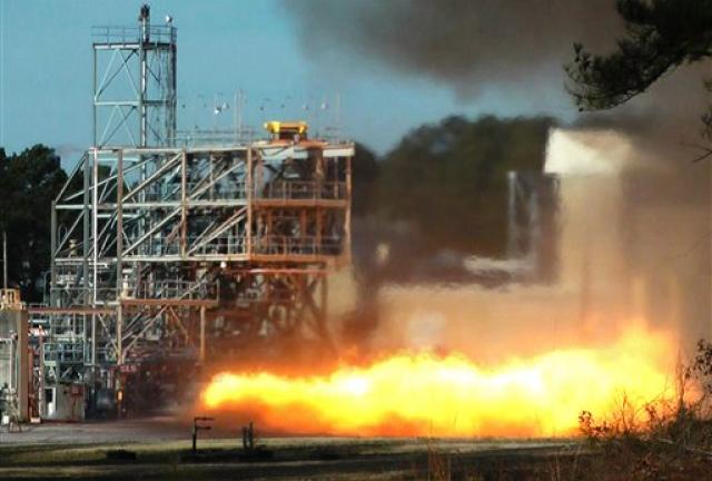 NASA engineers test fire a key part of a rocket engine left over from the 1960s-era Apollo moon missions on Janaury 24, 2013