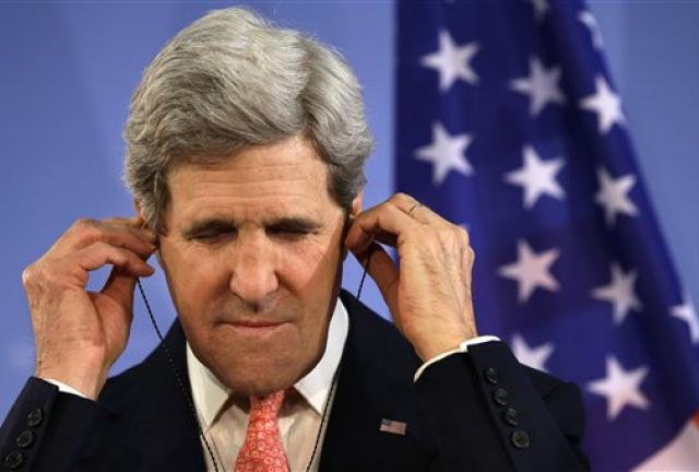 U.S. Secretary of State John Kerry adjusts his translation earphones while listening to German Foreign Minister Guido Westerwelle, not pictured, at a news conference at the Foreign Ministry in Berlin on Tuesday, Feb. 26, 2013. U.S. Secretary of State John Kerry adjusts his translation earphones while listening to German Foreign Minister Guido Westerwelle, not pictured, at a news conference at the Foreign Ministry in Berlin on Tuesday, Feb. 26, 2013.