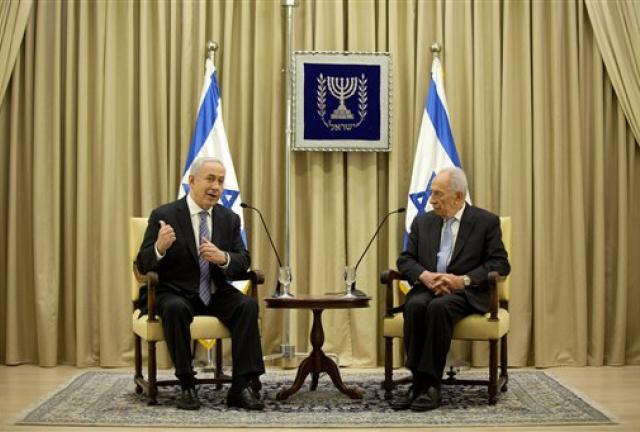 Israeli Prime Minister Benjamin Netanyahu, left, and Israeli President Simon Peres speak during a brief ceremony in the president's residence, on Saturday, March 2, 2024 in Jerusalem, Israel. 
